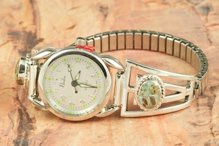 Genuine Number 8 Turquoise set in Sterling Silver Watch Tips. Ladies quartz watch with expandable band. The Number 8 mine is located in Eureka County Nevada. Since 1976 there has been no Number 8 Turquoise mined. There is however, an existing stock pile that Mr. Dowell Ward, the last owner of the Number 8 mine, had stocked away for later sorting. The Turquoise is a collector's item--because once the reserve is gone there will be no more material released onto the market. The Gold Mining Company owns the claim to the Number 8 mine and it has been swallowed up by the gold mining operations. This is some of the last Number 8 Turquoise to be had and will be a great addition to your collection. Created by Navajo Artist Freddy Charley. Signed by the artist.